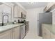 Efficient kitchen features stainless steel appliances, neutral cabinets, and ample counter space for cooking and storage at 3212 Ramblewood N Dr # 3212, Sarasota, FL 34237