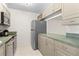 Well-equipped kitchen featuring stainless steel appliances, neutral cabinets, and ample counter space for all cooking needs at 3212 Ramblewood N Dr # 3212, Sarasota, FL 34237