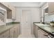 Functional kitchen with neutral cabinets, green countertop, undermount sink, and stainless steel appliances offers a clean aesthetic at 3212 Ramblewood N Dr # 3212, Sarasota, FL 34237
