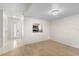 Open living space with wood floors, a bright entryway door, and a view into the kitchen, perfect for entertaining at 3212 Ramblewood N Dr # 3212, Sarasota, FL 34237
