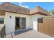 Private, covered patio with wood flooring and easy access to the home's interior through a sliding glass door at 3212 Ramblewood N Dr # 3212, Sarasota, FL 34237