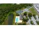 Beautiful community featuring tennis courts, a pool, and a tranquil pond at 3707 Wild Blossom Pl, Parrish, FL 34219