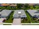 Aerial view of a well-maintained home with a paver driveway and lush landscaping at 3707 Wild Blossom Pl, Parrish, FL 34219