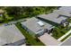 Aerial view of a home with a paved driveway, landscaping, and backyard at 3707 Wild Blossom Pl, Parrish, FL 34219