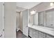 Well-lit bathroom with modern vanity, dual sinks, and a separate toilet area, designed for convenience and style at 3707 Wild Blossom Pl, Parrish, FL 34219