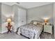 Cozy bedroom features a double bed, neutral walls, carpeted floors, and a double door closet, providing a serene retreat at 3707 Wild Blossom Pl, Parrish, FL 34219