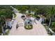Elegant gated community entrance with a water fountain feature and manicured landscaping at 3707 Wild Blossom Pl, Parrish, FL 34219