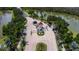 Beautiful view of the Isles community entrance with lush greenery and water features at 3707 Wild Blossom Pl, Parrish, FL 34219