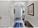 Bright foyer with hardwood floors, white door, recessed lighting and charming decor at 3707 Wild Blossom Pl, Parrish, FL 34219