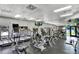 Well-equipped gym with treadmills, ellipticals, and weight machines, offering a variety of fitness options at 3707 Wild Blossom Pl, Parrish, FL 34219