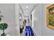 Bright and airy hallway featuring hardwood floors, recessed lighting and tasteful decor at 3707 Wild Blossom Pl, Parrish, FL 34219