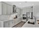 Modern kitchen featuring stainless steel appliances, custom cabinets, and stylish countertops, perfect for cooking and entertaining at 3707 Wild Blossom Pl, Parrish, FL 34219