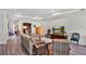 Comfortable living room with hardwood floors, neutral furniture, recessed lights and large TV at 3707 Wild Blossom Pl, Parrish, FL 34219