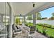Screened patio with brick pavers, outdoor furniture, and views of the landscaped backyard at 3707 Wild Blossom Pl, Parrish, FL 34219