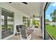 Screened patio with brick pavers, outdoor furniture, and views of the landscaped backyard at 3707 Wild Blossom Pl, Parrish, FL 34219
