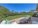 Lush backyard featuring a paved patio and landscaping, perfect for outdoor relaxation at 4208 Balmoral Way, Sarasota, FL 34238