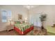 Bright bedroom featuring vaulted ceiling and a tropical-themed decor at 4208 Balmoral Way, Sarasota, FL 34238