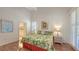 Comfortable bedroom with hardwood floors and adjacent bathroom access at 4208 Balmoral Way, Sarasota, FL 34238