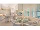 Cozy breakfast nook with glass table complemented by a kitchen view at 4208 Balmoral Way, Sarasota, FL 34238