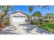 Beautiful single-Gathering home featuring a well-manicured lawn and a two-car garage at 4208 Balmoral Way, Sarasota, FL 34238