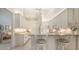 Modern kitchen boasts white cabinetry, granite countertops, and a breakfast bar with seating at 4208 Balmoral Way, Sarasota, FL 34238
