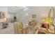 Bright living room features tall ceilings, large windows, and stylish, coordinated furniture at 4208 Balmoral Way, Sarasota, FL 34238