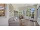 Relaxing sunroom with tiled floors, providing serene garden vistas at 4208 Balmoral Way, Sarasota, FL 34238