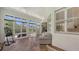 Sunny sunroom with multiple windows showcases views of the outdoor landscape at 4208 Balmoral Way, Sarasota, FL 34238