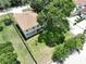 Back aerial view of the two-story home with a fenced back yard with a trampoline at 4209 W Woodlawn Ave, Tampa, FL 33614