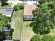 Aerial view of the back of the house and a large back yard with trampoline at 4209 W Woodlawn Ave, Tampa, FL 33614