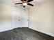 A bright bedroom has dark floors, two doors, and ample natural light at 4209 W Woodlawn Ave, Tampa, FL 33614