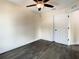 A well-lit bedroom features dark wood floors, ceiling fan, and neutral walls at 4209 W Woodlawn Ave, Tampa, FL 33614