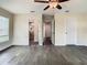 Bedroom featuring hardwood floors and multiple doors to bathrooms and closets at 4209 W Woodlawn Ave, Tampa, FL 33614