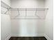 Walk-in closet with wire shelving and dark wood-look flooring at 4209 W Woodlawn Ave, Tampa, FL 33614