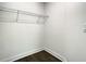 A walk-in closet features wire shelving and dark wood-look floors at 4209 W Woodlawn Ave, Tampa, FL 33614