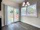 Charming dining area with sliding glass doors, bright windows, and space for a cozy breakfast nook at 4209 W Woodlawn Ave, Tampa, FL 33614