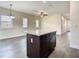 Open floor plan featuring a kitchen island with a granite countertop and stylish cabinets at 4209 W Woodlawn Ave, Tampa, FL 33614