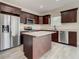 Modern kitchen featuring stainless steel appliances, granite countertops, and a center island at 4209 W Woodlawn Ave, Tampa, FL 33614