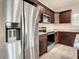 Modern kitchen featuring stainless appliances, granite counters, and beautiful cabinets at 4209 W Woodlawn Ave, Tampa, FL 33614