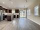 Spacious kitchen with stainless steel appliances, granite countertops, and sliding glass doors to the backyard at 4209 W Woodlawn Ave, Tampa, FL 33614