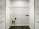 The laundry room has a wire shelf and washer and dryer hookups at 4209 W Woodlawn Ave, Tampa, FL 33614