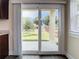 View through sliding glass doors to the backyard and patio at 4209 W Woodlawn Ave, Tampa, FL 33614