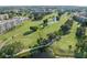 Beautiful aerial view of the golf course and condo community with mature trees and ponds at 4410 Fairways Blvd # 104, Bradenton, FL 34209