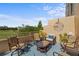Balcony with comfortable seating arrangements and a view of the lush green surroundings at 4410 Fairways Blvd # 104, Bradenton, FL 34209