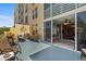 Inviting balcony area with patio seating, plants, and open access to the interior at 4410 Fairways Blvd # 104, Bradenton, FL 34209