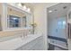 Modern bathroom featuring a sleek vanity and a spacious glass-enclosed shower, with stylish fixtures and finishes at 4410 Fairways Blvd # 104, Bradenton, FL 34209