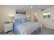 Inviting bedroom offers a serene atmosphere, enhanced by soft lighting and a charming connection to the en-suite bathroom at 4410 Fairways Blvd # 104, Bradenton, FL 34209