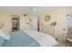 Bright bedroom with a serene atmosphere and direct access to the en-suite bathroom, complemented by large window at 4410 Fairways Blvd # 104, Bradenton, FL 34209