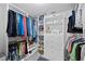 Walk-in closet with organized shelving and hanging spaces, providing ample storage for clothing and accessories at 4410 Fairways Blvd # 104, Bradenton, FL 34209
