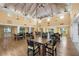The clubhouse features seating for many with multiple tables and chairs, chandeliers, and windows at 4410 Fairways Blvd # 104, Bradenton, FL 34209